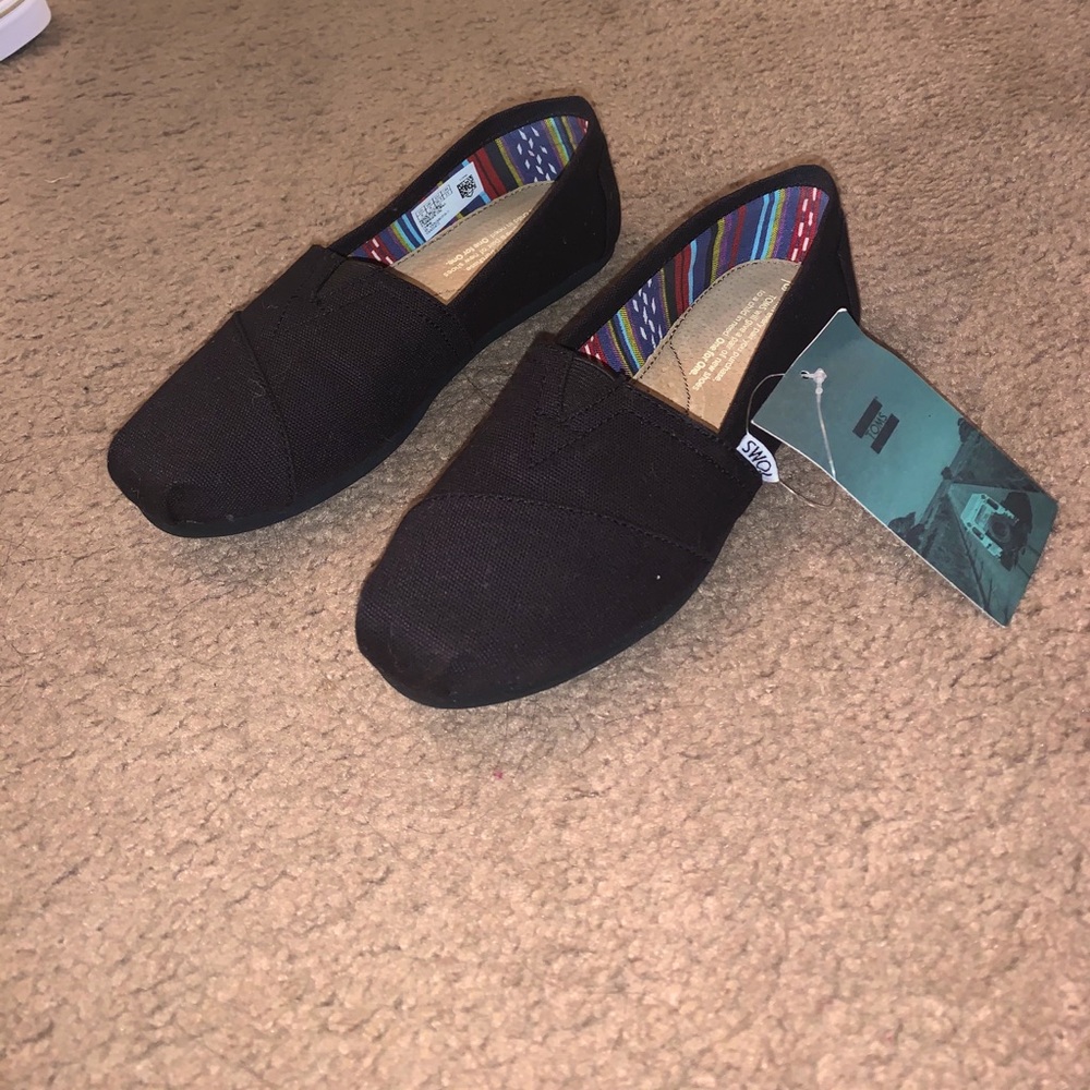 TOMS brand new black shoes...never been worn...